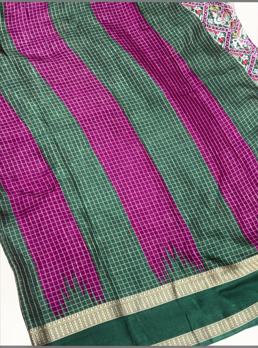 KANISHKA SILKS viscose chiffon saree in deep magenta and green checks with a traditional gold temple border
